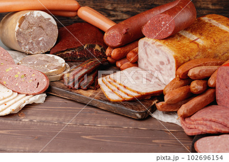 Variety of meat and sausage products on table Variety of meat and sausage products on table 102696154