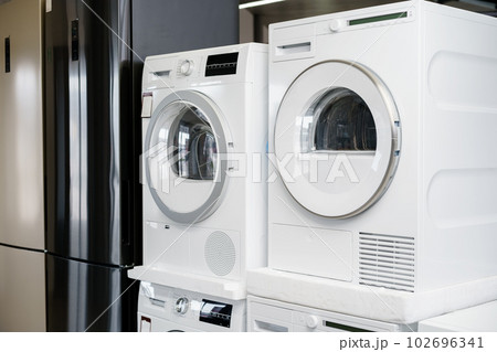 Close up of new dryer machine in household appliances store Close up of new dryer machine in household appliances store 102696341