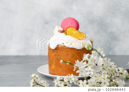 Beautiful Easter cake decorated with macarons cookie and dry orange piece Beautiful Easter cake decorated with macarons cookie and dry orange piece 102696441
