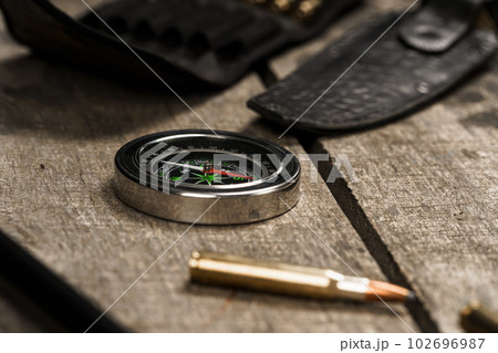 Hunting equipment on old dark wooden background 102696987