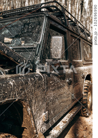 Dirty off road car on trip in forest Dirty off road car on trip in forest 102696990