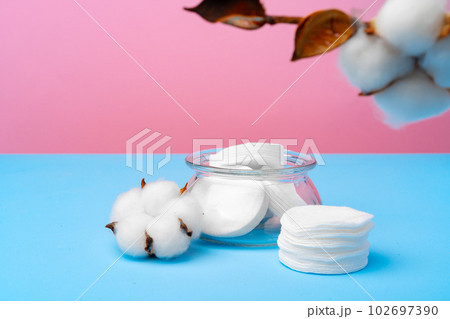Female medical tampons on pink and blue background 102697390