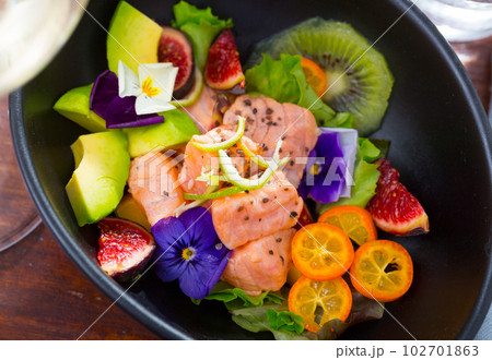 Ceviche of salmon with kiwi fruit, avocado, kumquat, figs 102701863