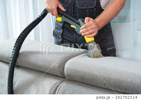 Sofa chemical cleaning with professionally extraction method. Wet textile sofa cleaning Sofa chemical cleaning with professionally extraction method. Wet textile sofa cleaning 102702514