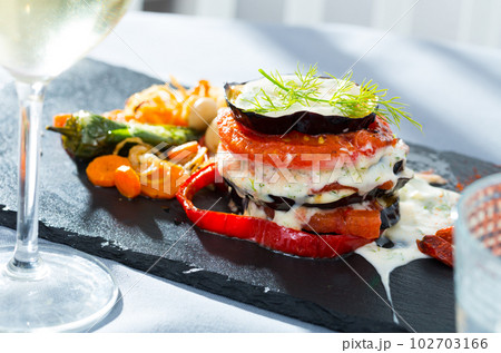 Fried eggplant and tomato pyramid Fried eggplant and tomato pyramid 102703166