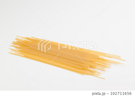 Spaghetti spread out on a white surface. Spaghetti spread out on a white surface. 102711656