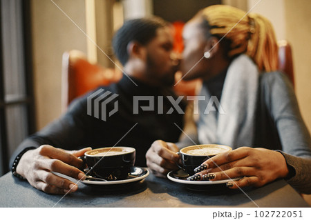 Two young people in cafe. African couple enjoying the time spending with each other. 102722051