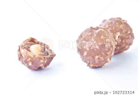 chocolate ball stuffed peanut biting arranging on white background chocolate ball stuffed peanut biting arranging on white background 102723314