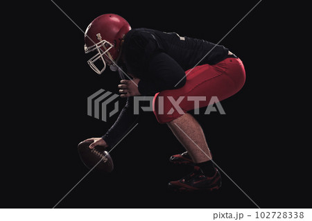 Football player on dark background 102728338