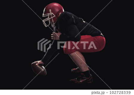 Football player on dark background 102728339