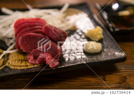 Horsetail meat raw sashimi with wasabi, ginger, soy sauce Horsetail meat raw sashimi with wasabi, ginger, soy sauce 102730414