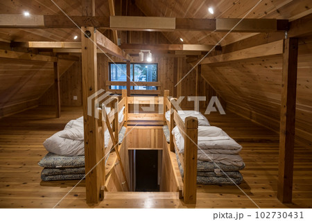 Japanese Futon bed and blanket on house top wooden floor Japanese Futon bed and blanket on house top wooden floor 102730431