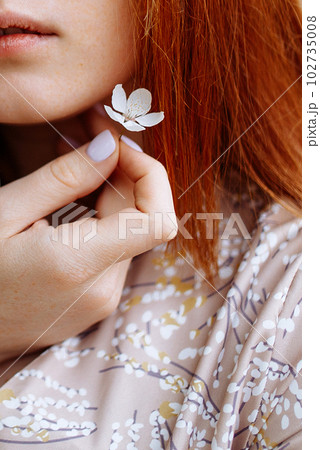Young beautiful lady with rose on grey background. Skin care concept 102735008