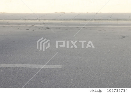 A street border painted in white , minimalism. A street border painted in white , minimalism. 102735754