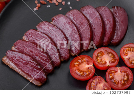 Delicious duck fillet smoked or grilled with spices and salt 102737995