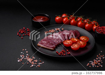 Delicious duck fillet smoked or grilled with spices and salt 102737996