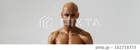 Portrait of attractive sporty man with muscled naked body on white studio background 102738755