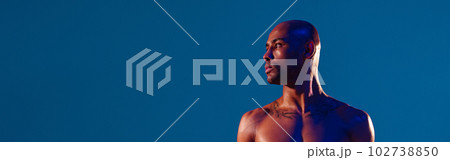 Muscular man doing exercise with weight dumbbells on studio background. Strength and motivation Muscular man doing exercise with weight dumbbells on studio background. Strength and motivation 102738850
