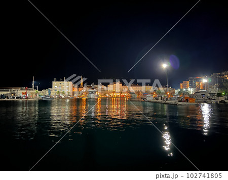 Embankment of the resort town on the seashore with illumination Embankment of the resort town on the seashore with illumination 102741805