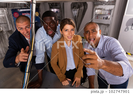 Emotional group of friends looking at the camera in quest room 102747901