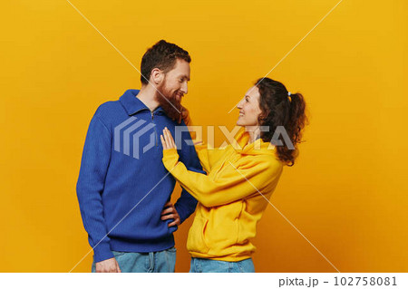 Man and woman couple smile and happiness, yellow background, family  102758081