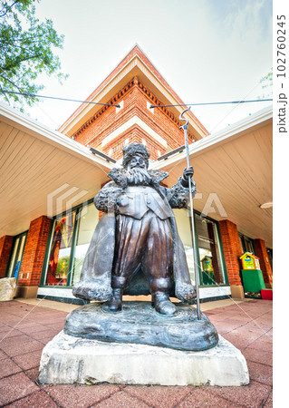 A life-sized sculpture of Nicholas St. North stands proudly in front of a building in Abilene, Texas. 102760245