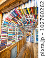 A large group of multi-colored books fill the tunnel at Intermission Bookshop in Brownwood, Texas. 102760262