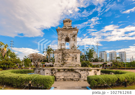 Mactan Shrine, aka Liberty Shrine, a memorial park on Mactan in Lapu Lapu City, Cebu, Philippines. Translation Mactan Shrine, aka Liberty Shrine, a memorial park on Mactan in Lapu Lapu City, Cebu, Philippines. Translation 102761268