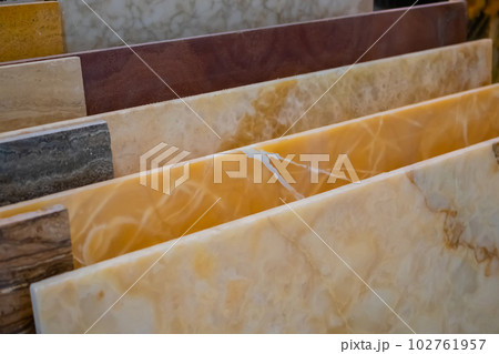 Colorful granite and marble stone slabs on counter for sale at hardware store Colorful granite and marble stone slabs on counter for sale at hardware store 102761957