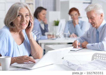 business woman with smartphone working in office business woman with smartphone working in office 102763331