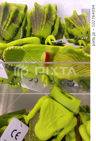 Close-up of toy dinosaurs on store shelves. Close-up of toy dinosaurs on store shelves. 102764094