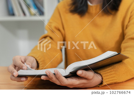 Pray and religion concept, Female christian read holy bible to studying of faith and spirituality 102766674