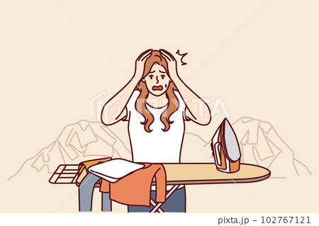 Housewife woman ironing clothes and clutching head in panic due to overload and fatigue 102767121