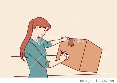 Woman with cardboard box signs package before sending goods through postal service or courier Woman with cardboard box signs package before sending goods through postal service or courier 102767149