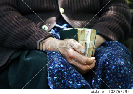 Elder hands holding the Holy Bible 102767298
