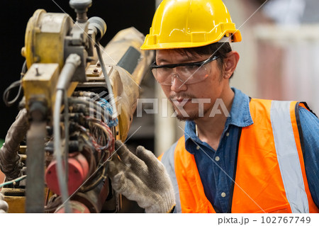 engineering worker man wearing uniform safety and hardhat working machine lathe metal in factory engineering worker man wearing uniform safety and hardhat working machine lathe metal in factory 102767749