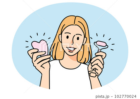 Woman hold jade roller and gua sha 102770024