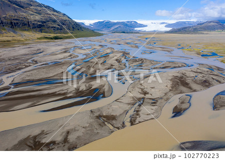 Aerial view of a riverbed and water streams in Iceland Aerial view of a riverbed and water streams in Iceland 102770223