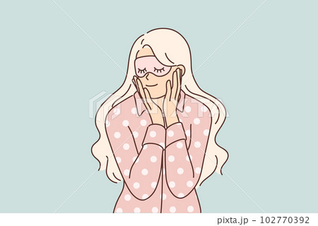 Woman in pajamas and sleep mask smiles getting ready for night rest after hard day work Woman in pajamas and sleep mask smiles getting ready for night rest after hard day work 102770392