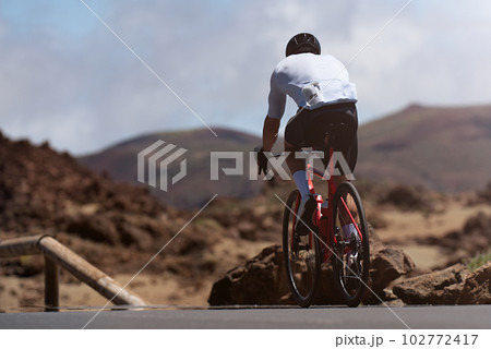 Road bike cyclist man cycling. Biking sport fitness athlete biking on road bike Road bike cyclist man cycling. Biking sport fitness athlete biking on road bike 102772417
