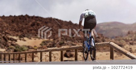 Road bike cyclist man cycling. Biking sport fitness athlete biking on road bike Road bike cyclist man cycling. Biking sport fitness athlete biking on road bike 102772419