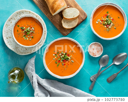 Gaspacho soup on blue, top view Gaspacho soup on blue, top view 102773780