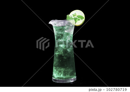 Blue Lagoon or Blue Hawaii  Cocktail - A summer alcoholic drink with vodka, tonic, and water  on black background,  selective focus, soft focus. 102780719