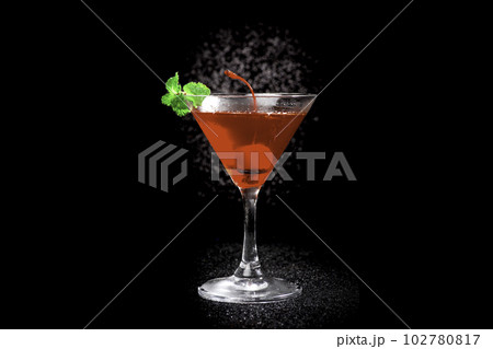 Red cocktail and mint on black background 102780817