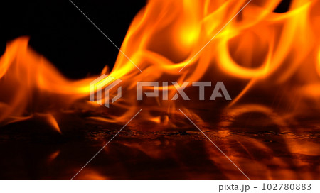 burning power of the flame, Flames and burning sparks close-up, fire patterns, the glow of fire in the dark. soft focus. 102780883