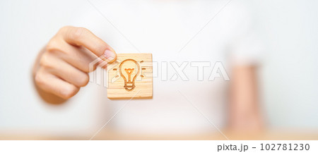 hand hold lightbulb  block with business Idea, strategy, innovation , creativity, learning, brainstorming  and success concept hand hold lightbulb  block with business Idea, strategy, innovation , creativity, learning, brainstorming  and success concept 102781230
