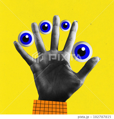 Contemporary art collage of human palm with several eye balls between fingers over yellow color background. Surrealism 102787815