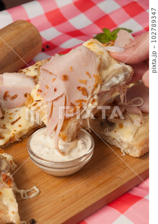 tasty cream-based pizza with ham and mushrooms tasty cream-based pizza with ham and mushrooms 102789347