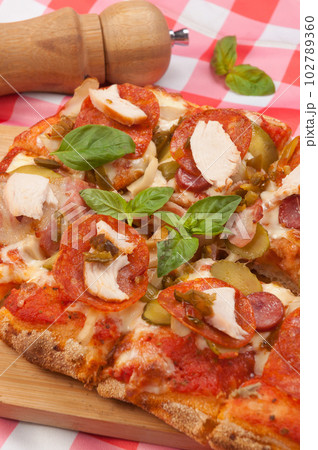 italian pizza with pepperoni, bacon, chicken and mushrooms italian pizza with pepperoni, bacon, chicken and mushrooms 102789360