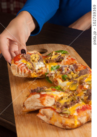 girl tries a piece of italian pizza girl tries a piece of italian pizza 102789369